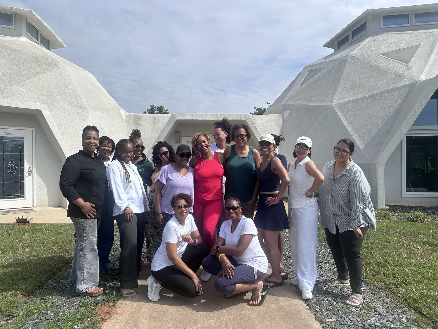 Retreat guests gathered at the domes